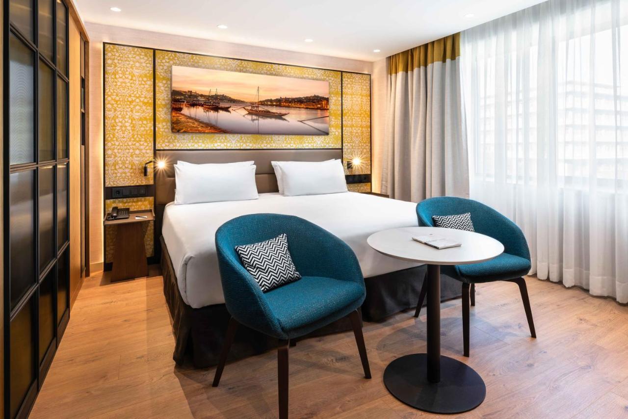 Eurostars Aliados Hotel ปอร์โต ภายนอก รูปภาพ A room at the hotel