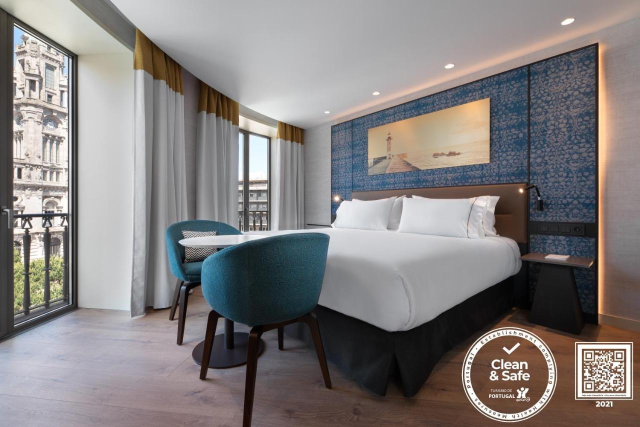 Eurostars Aliados Hotel ปอร์โต ภายนอก รูปภาพ A Clean & Safe certified hotel room in Lisbon, Portugal